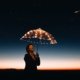 woman using umbrella with lights